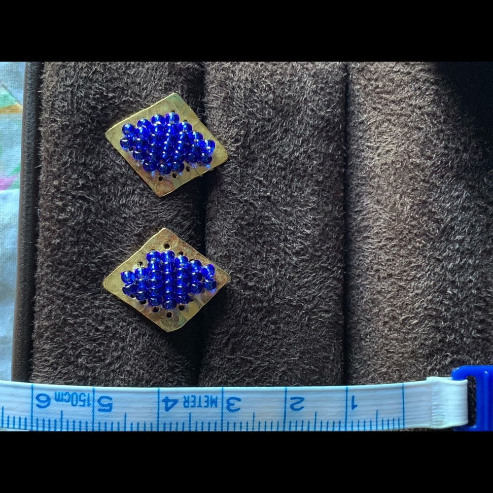 Golden earrings with blue beads
